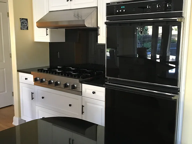 Cooktop & double ovens, walk in panty to the far left.
