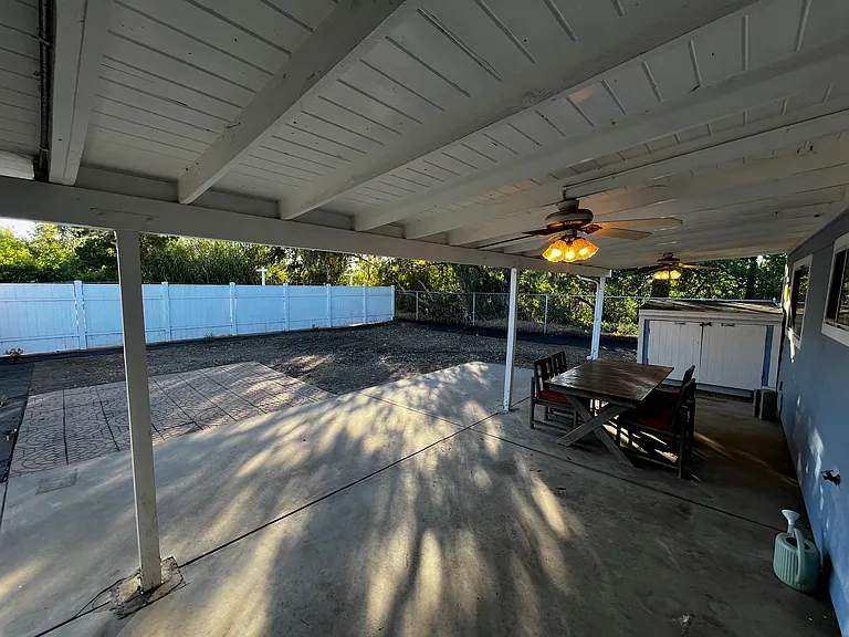 COVERED PATIO AND BACKYARD