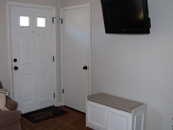 Front door, coat closet