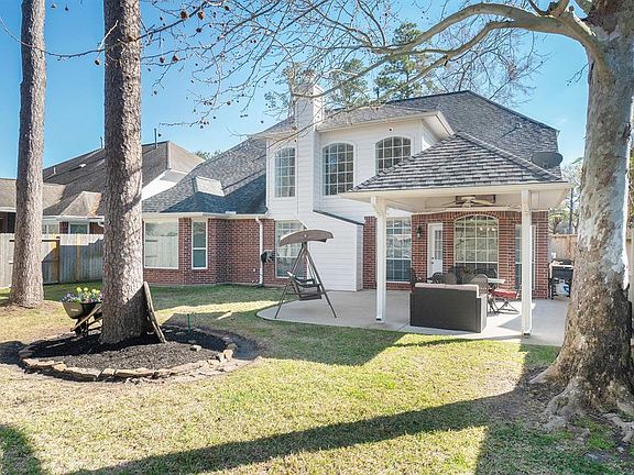 Enjoy the beautifully wooded backyard under the comfort of the large covered patio.
