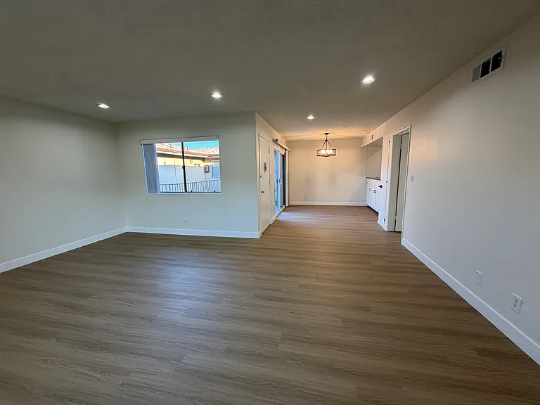 Living Room and Dining Area with Modern Style Wood Floors