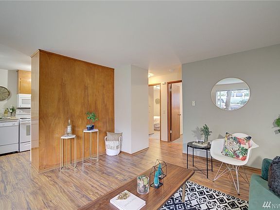 Model unit.  Some have LVT floor like this, others have carpet.  All have birch focal wall and birch cabinets, original tile, updated appliances including micro and DW