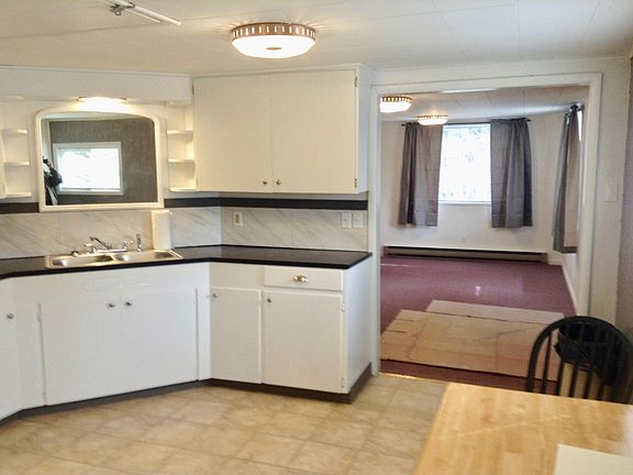 Kitchen to living room. (cardboard down to protect carpet.)