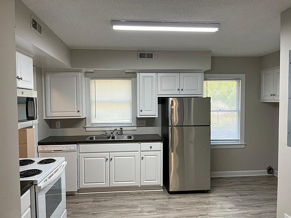 Kitchen with new stainless steel refrigerator