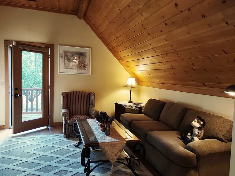 Spacious & Cozy Living Room with Queen Size Pull Out Sofa, Queen Anne Chair, Large Screen TV & Enjoy the Morning Sunshine on Balcony with Table & Chairs