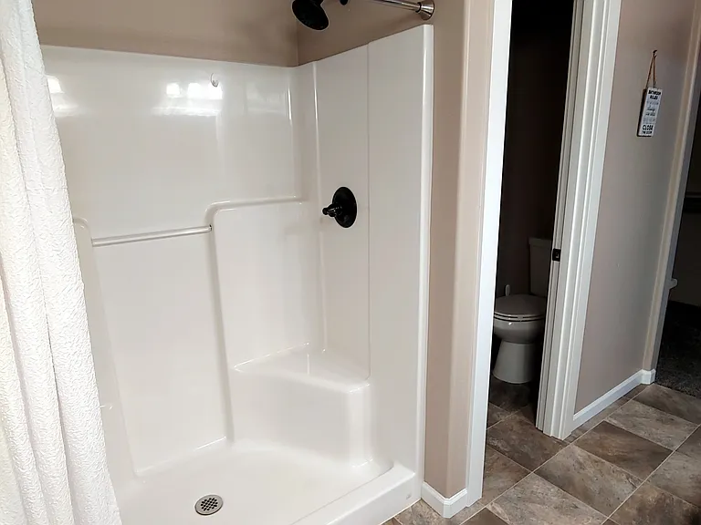 Master shower/toilet room.