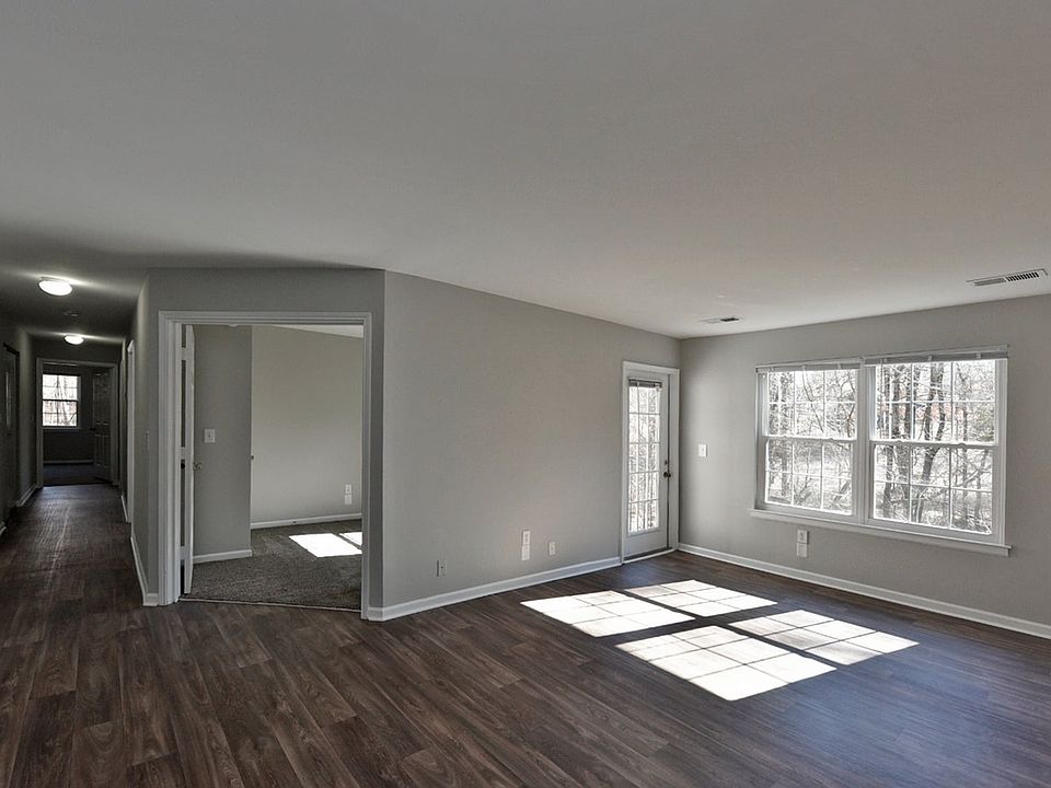 Spacious living room with hardwood-style flooring