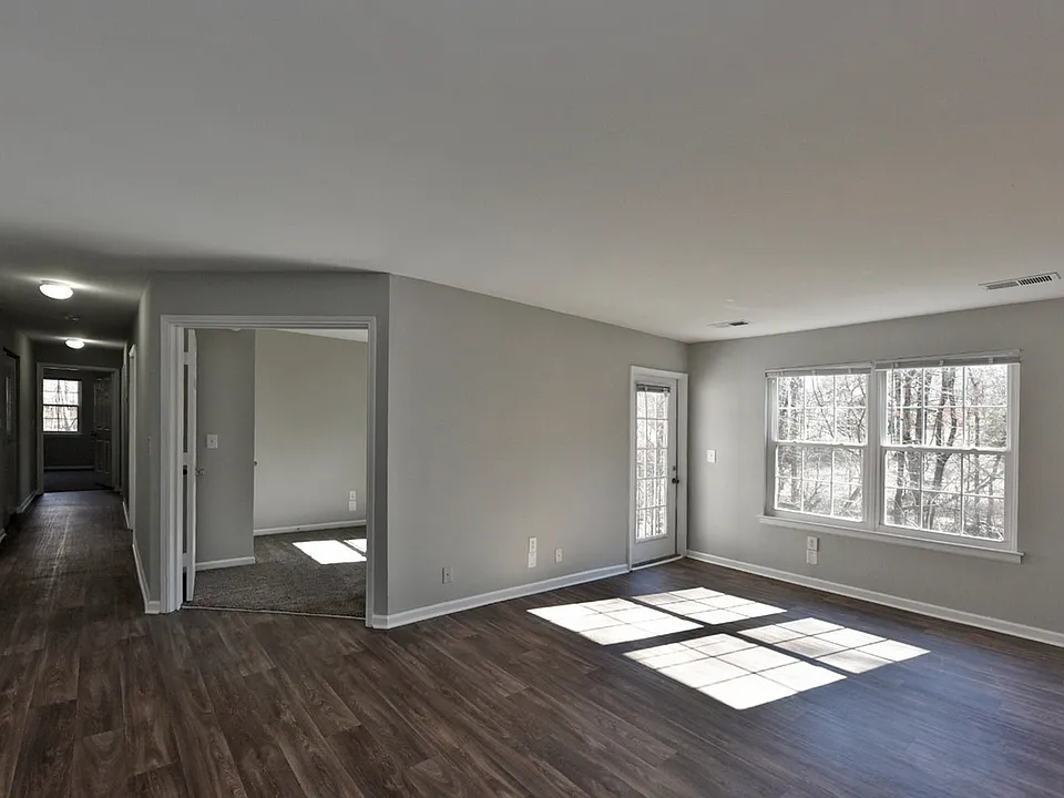 Spacious living room with hardwood-style flooring