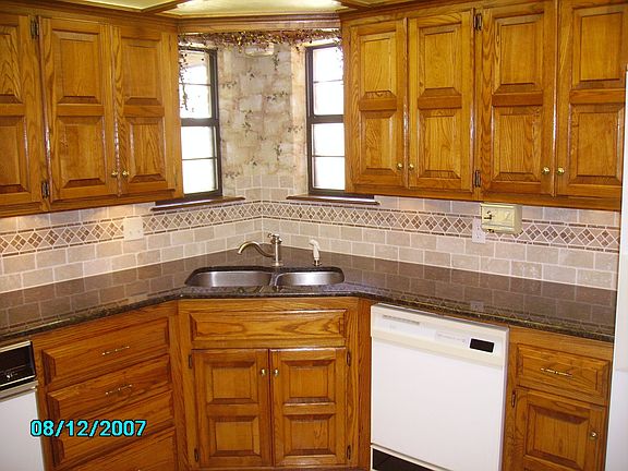 granite counter tops and tiled backsplash