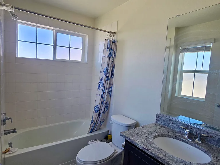 Second bathroom connected to bedroom with lots of natural light and convenient privacy.