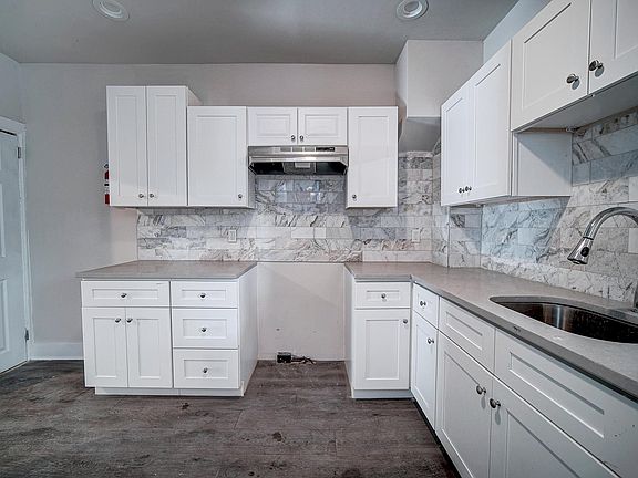 Kitchen includes a stove and fridge