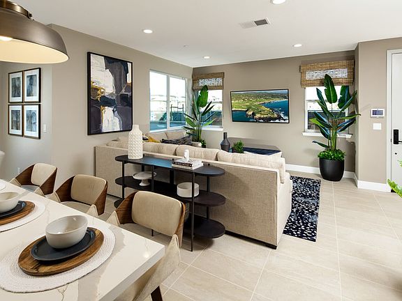 In this open and interconnected space, the kitchen dining room and great room come together to offer
