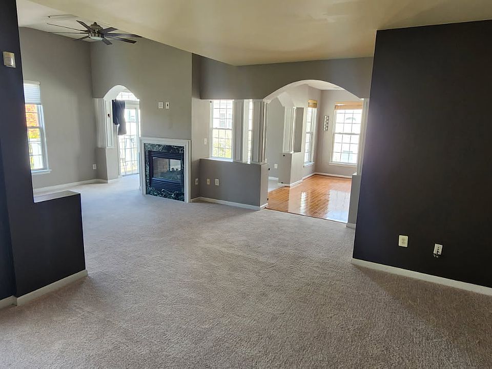 Den leading to living area and kitchen