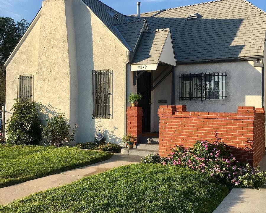 Lush grassy front yard.