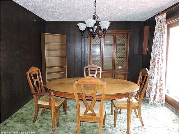 Dining with sliding glass door on right to the deck