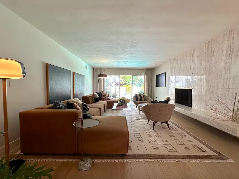 formal living room with gallery frame tv