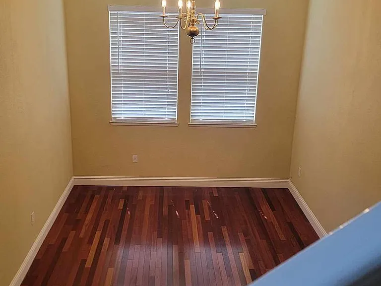 View of dining room while descending staircase