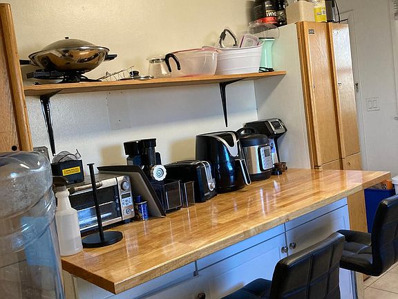 Breakfast Bar, Pantry Lockers, and extra storage in kitchen