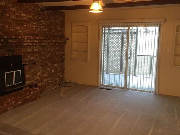 Family room with fireplace insert -- sliding doors go out to deck in back.