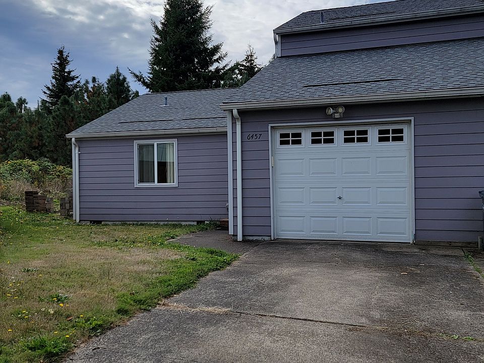 Front of house, driveway and garage.