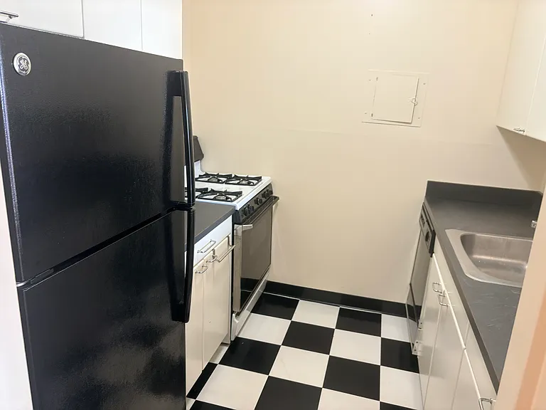 Interior photos taken before new carpeting and fresh paint.
