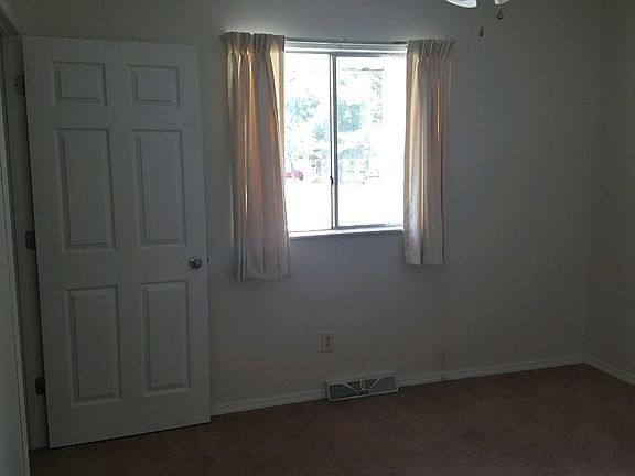 LARGE BEDROOMS WITH NICE CLOSET. CEILING FAN & DRAPES
