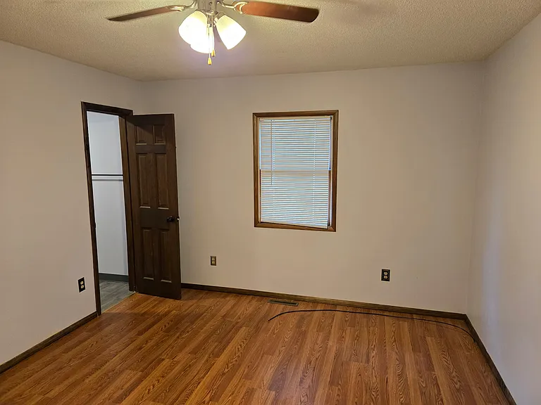 Entry door to attached bathroom off Bedroom 1.