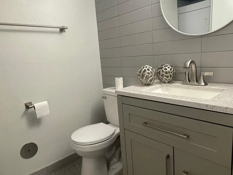 Upstairs restroom. Completely remodeled with full height tile finish, kohler fixtures.