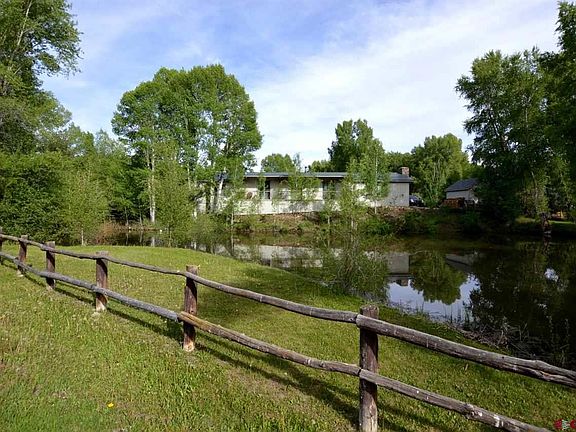 Fenced yard with views of private pond, and golf course open space.