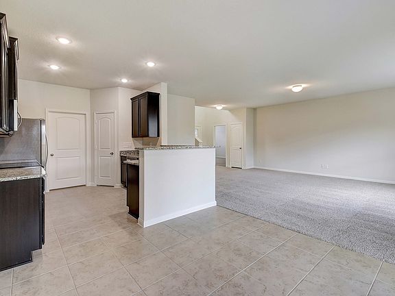 The dining room is located near the kitchen.