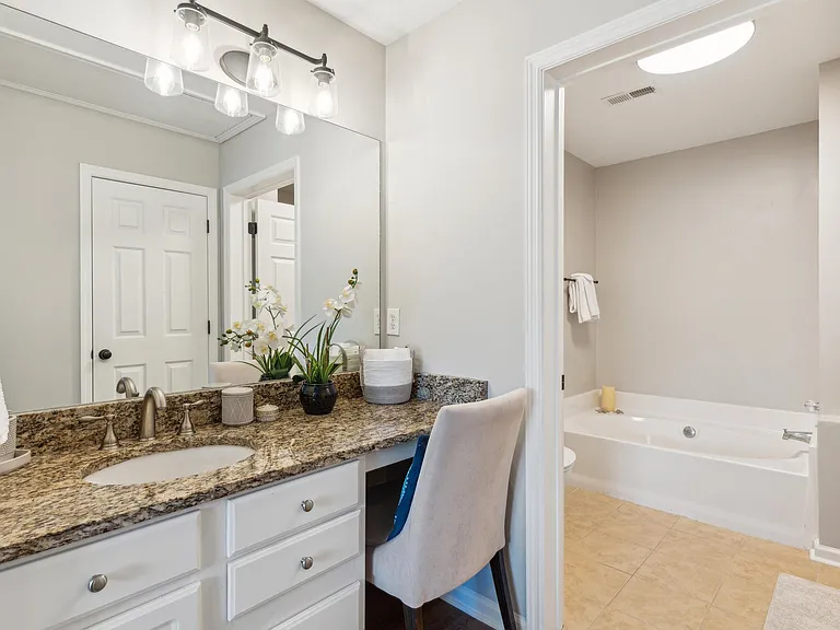 The shower is to the right of the garden tub