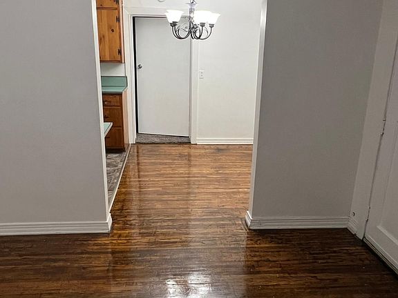 Eat in Kitchen area with new lighting with open living room