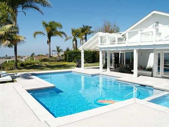 View of pool and house