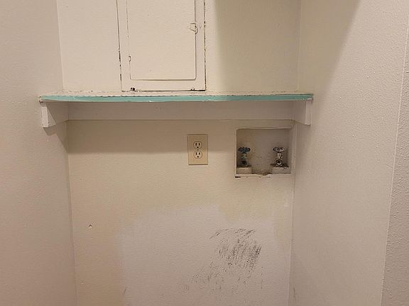 Washer hook-up in the closet off of first bedroom (please note, the patched area will be painted before occupancy)