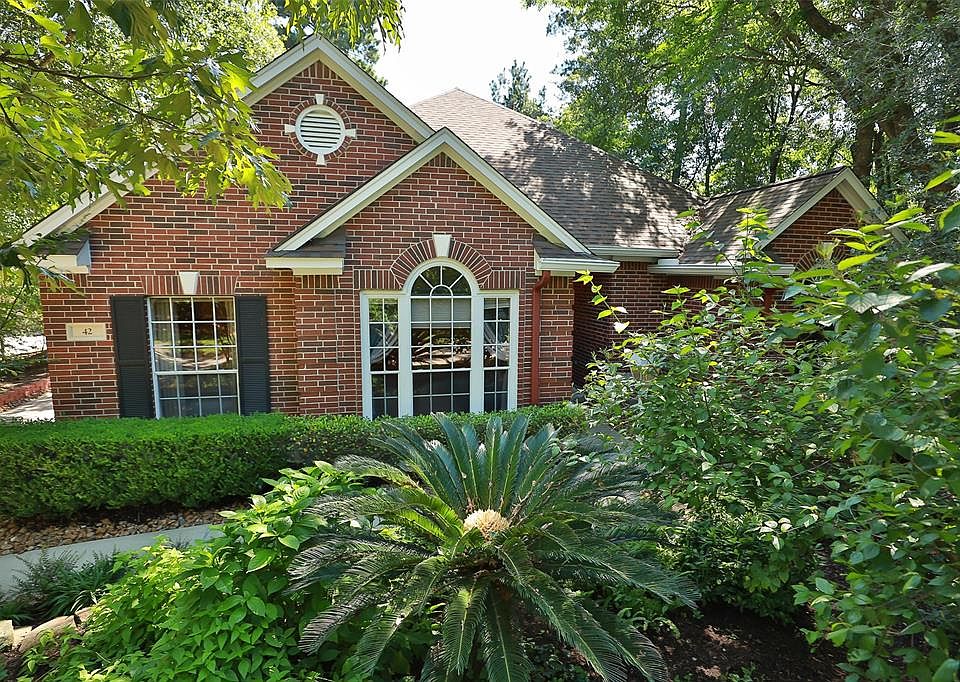 Welcome home to 42 Magnolia Shadows Pl. Fantastic updated one story Village Builder home with 4 car tandem garage.