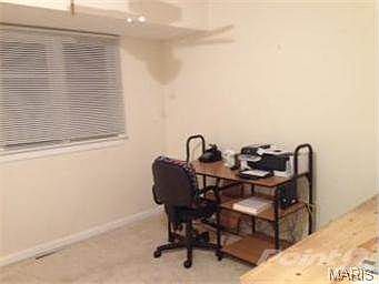 The third bedroom is being used as an office.