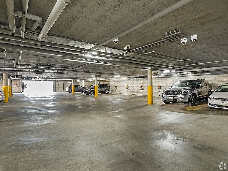 Large covered parking lot with assigned parking.