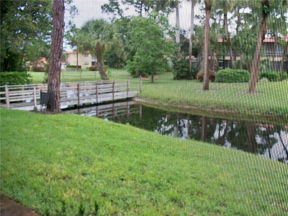 Very peaceful setting overlooking pond / stream with bridge and golf course views