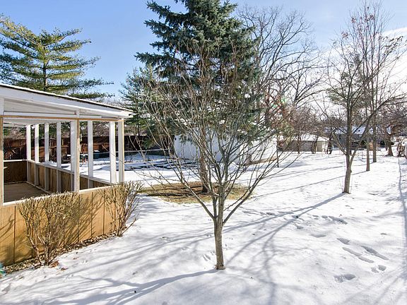 Covered concrete patio * Partial fenced backyard