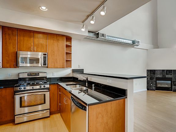 Kitchen with granite counter tops and stainless steel appliances