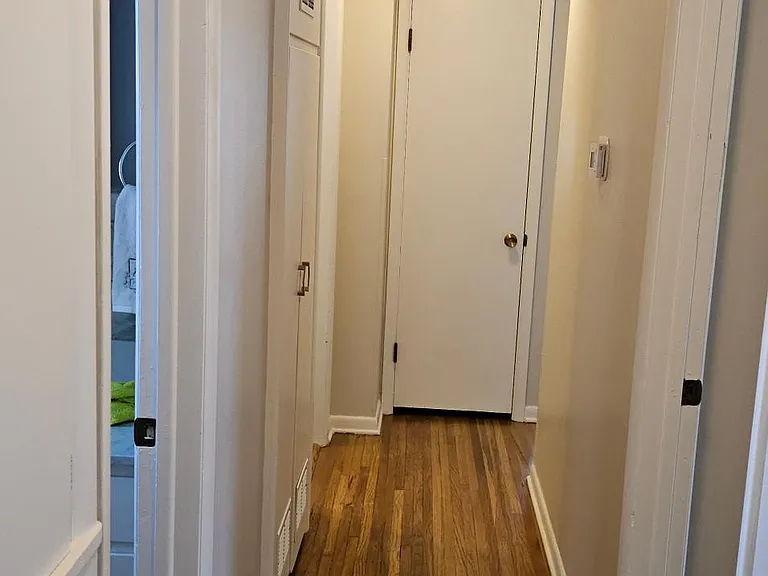 Hall with refurbished floors and new paint.