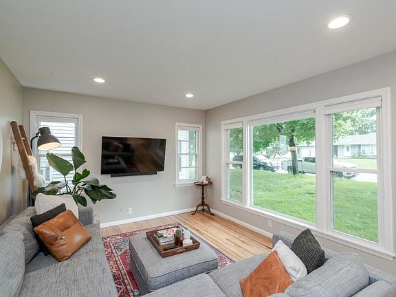 Sunny living room with refinished hardwood floors!