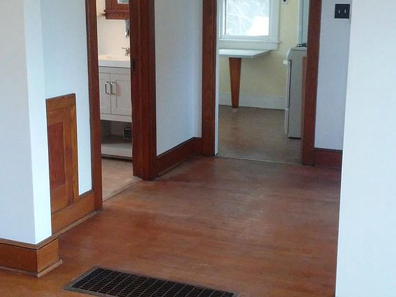 View from Living Room into the Dining Area and Kitchen, Bathroom on left