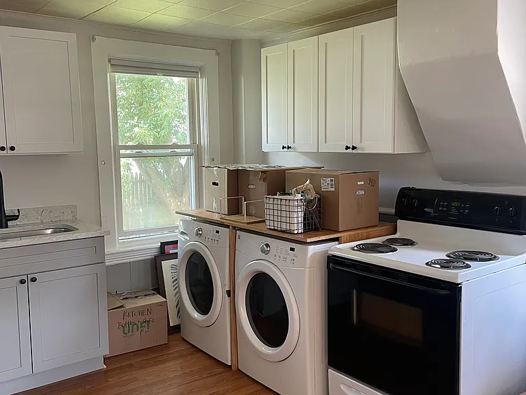 Kitchen showing washer/dryer hook-up