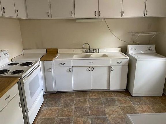 Kitchen with washer shown