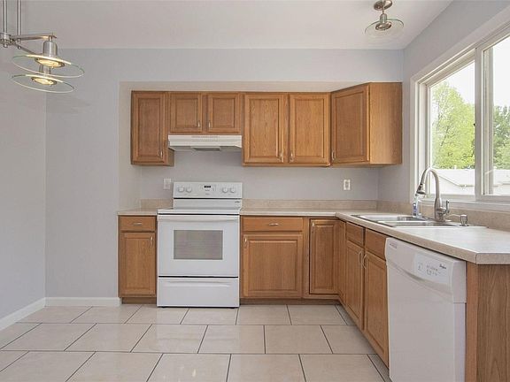 Kitchen -- new light fixtures, tile floor, fresh paint.