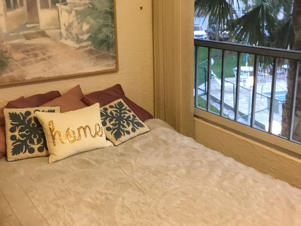 Dropped bed behind drapes 