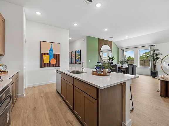 Kitchen in the Pecos home plan by Trophy Signature Homes - REPRESENTATIVE PHOTO