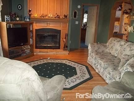 LIvingroom
						:
						The fireplace is waiting to pop and crack on a cool evening.