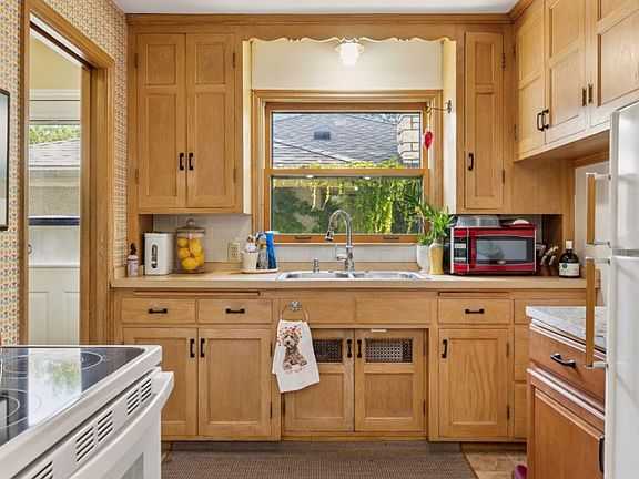 The kitchen in its current state - this is currently being renovated to have all new cabinetry, a pantry, and quartz countertops.